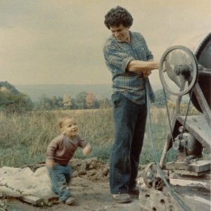 Vic and our son Anthony working on the crumbling stone foundation, 1976